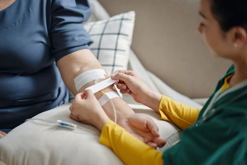 nurse giving patient an iv